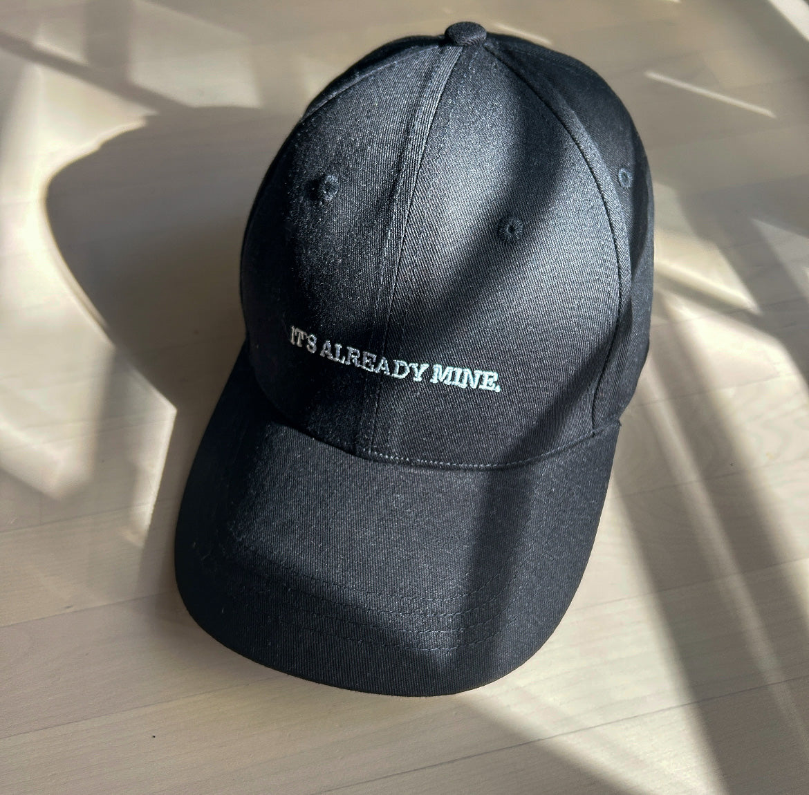 BLACK THE "IT'S ALREADY MINE." HAT